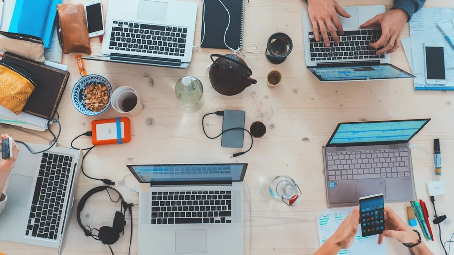 Team building a no-code restaurant app on laptop in 30 minutes