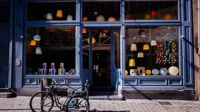 Local restaurant storefront with open sign and marketing materials