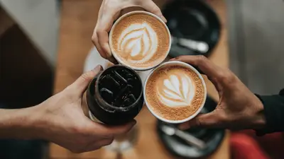 Digital punch card loyalty app on smartphone at coffee shop